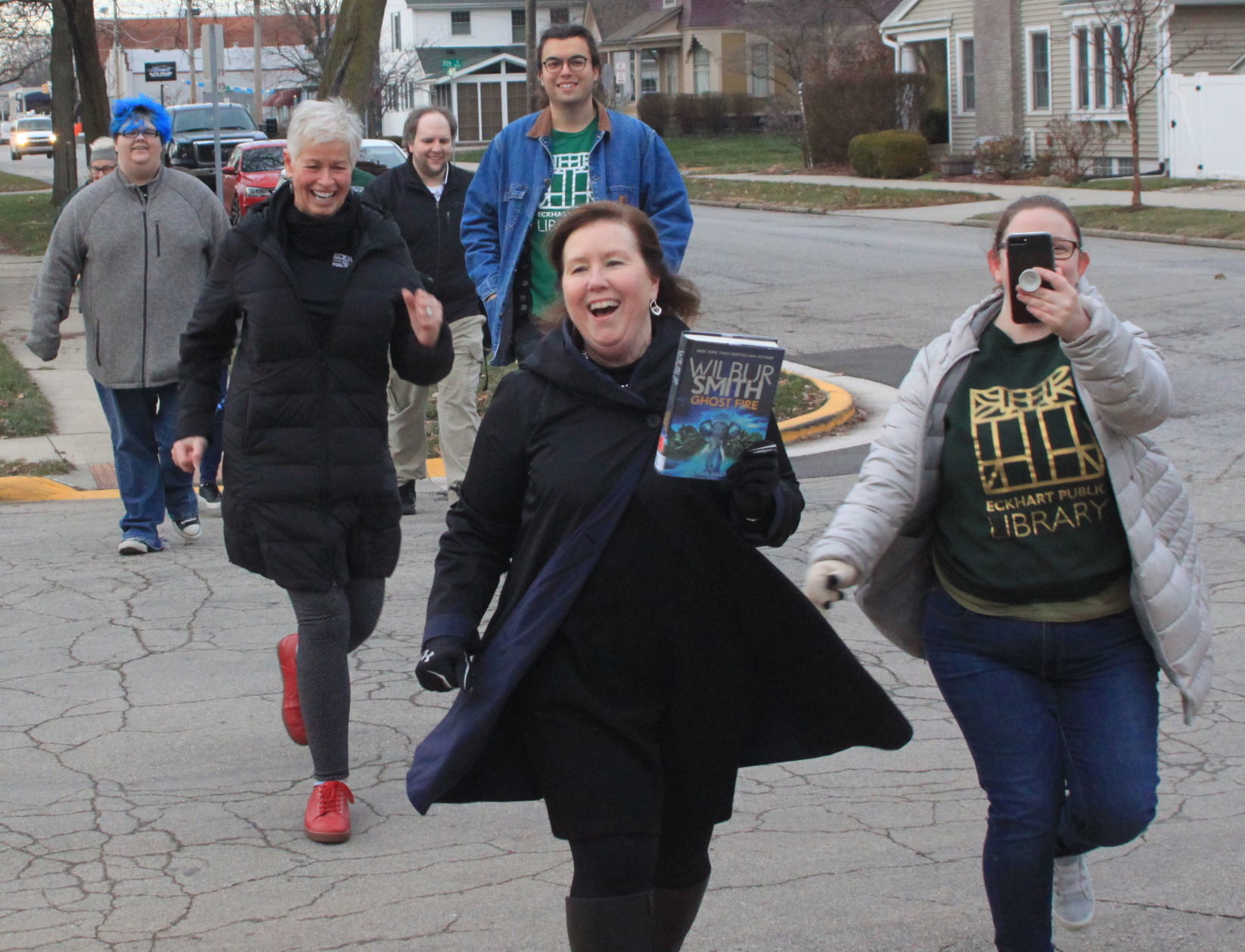 Library staff brings books back home